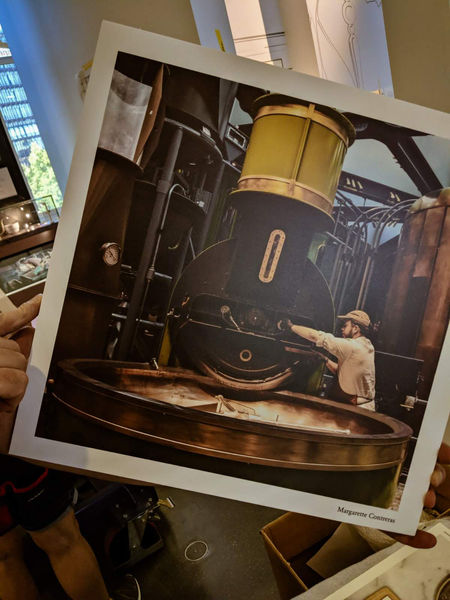 Framed photograph of a roaster at work